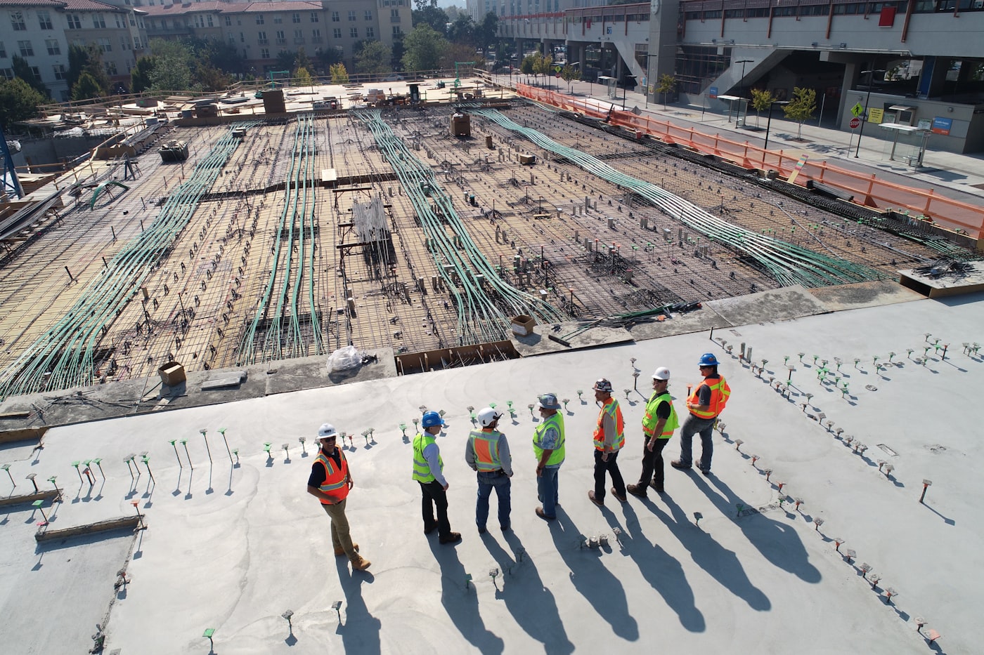 Construction crew reviewing a building site